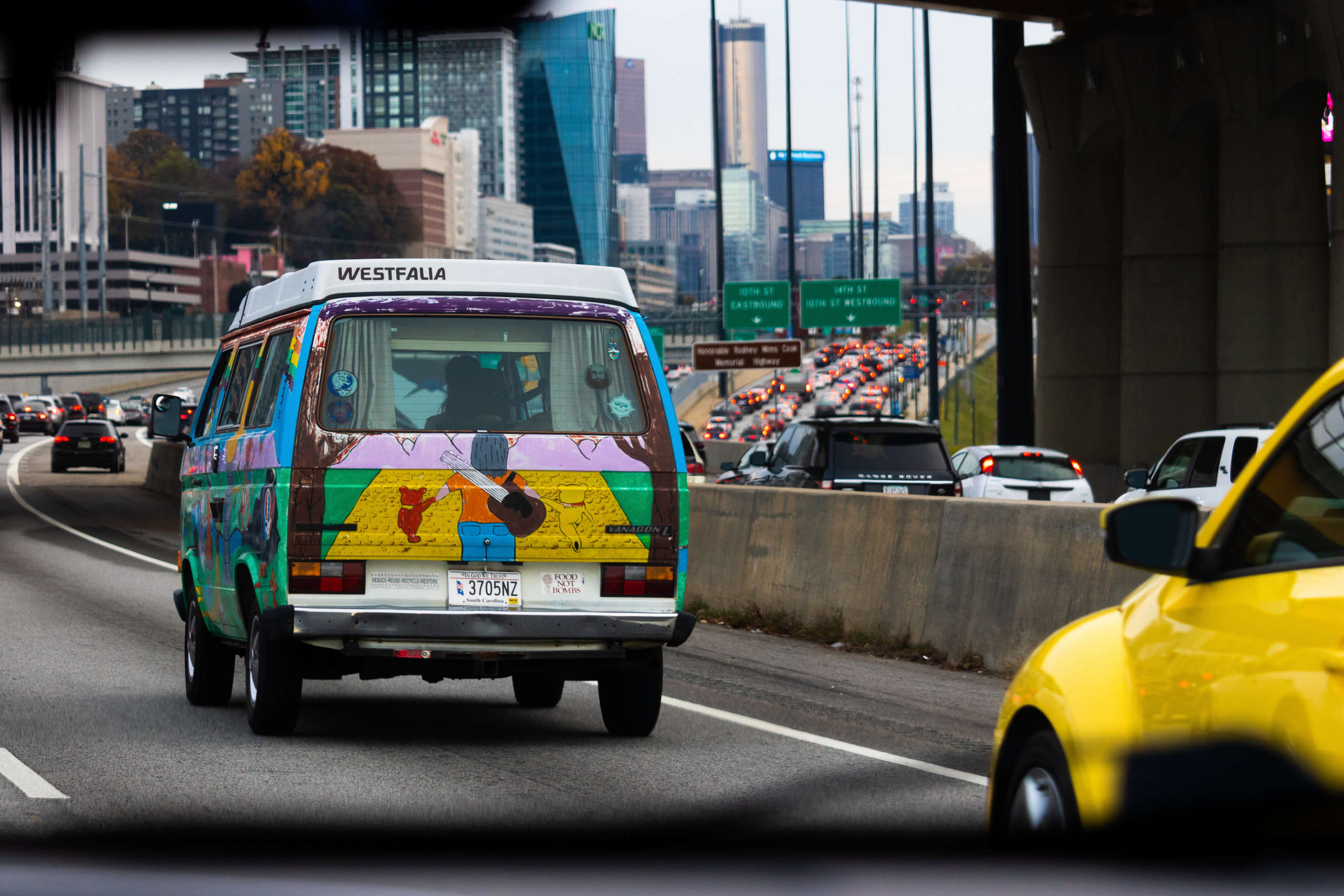 A colorful van drives along the Atlanta highway.
