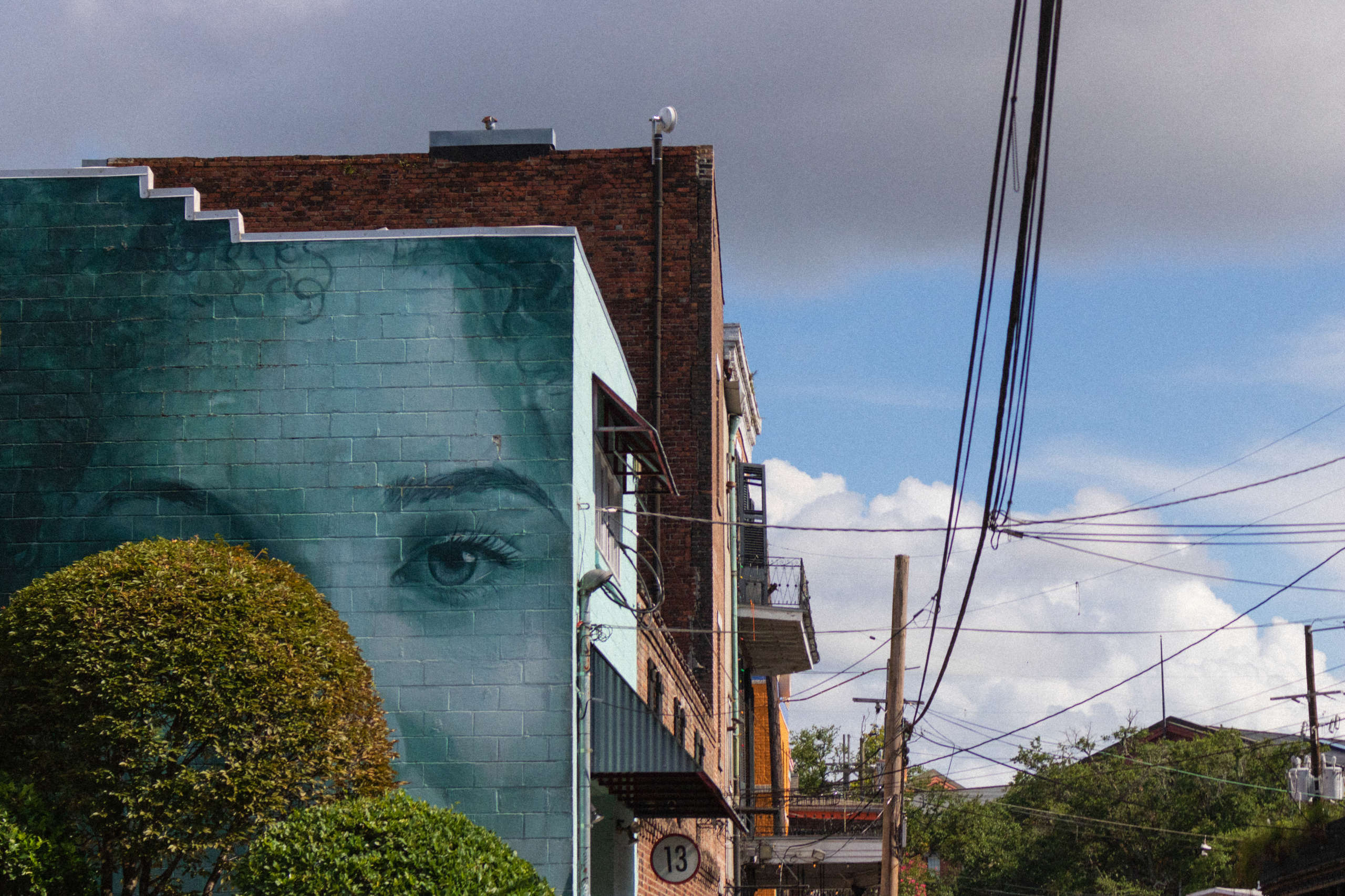 A mural of a face on a building.