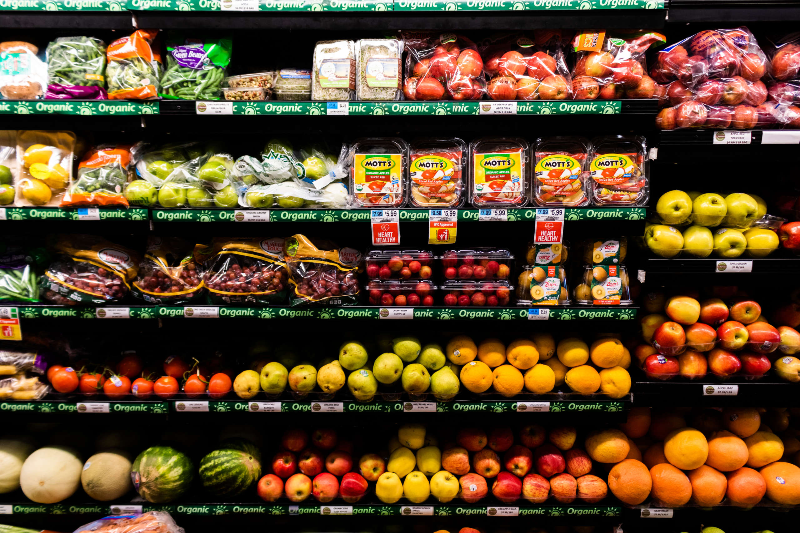 Organic produce sits on the shelves of a grocery store.