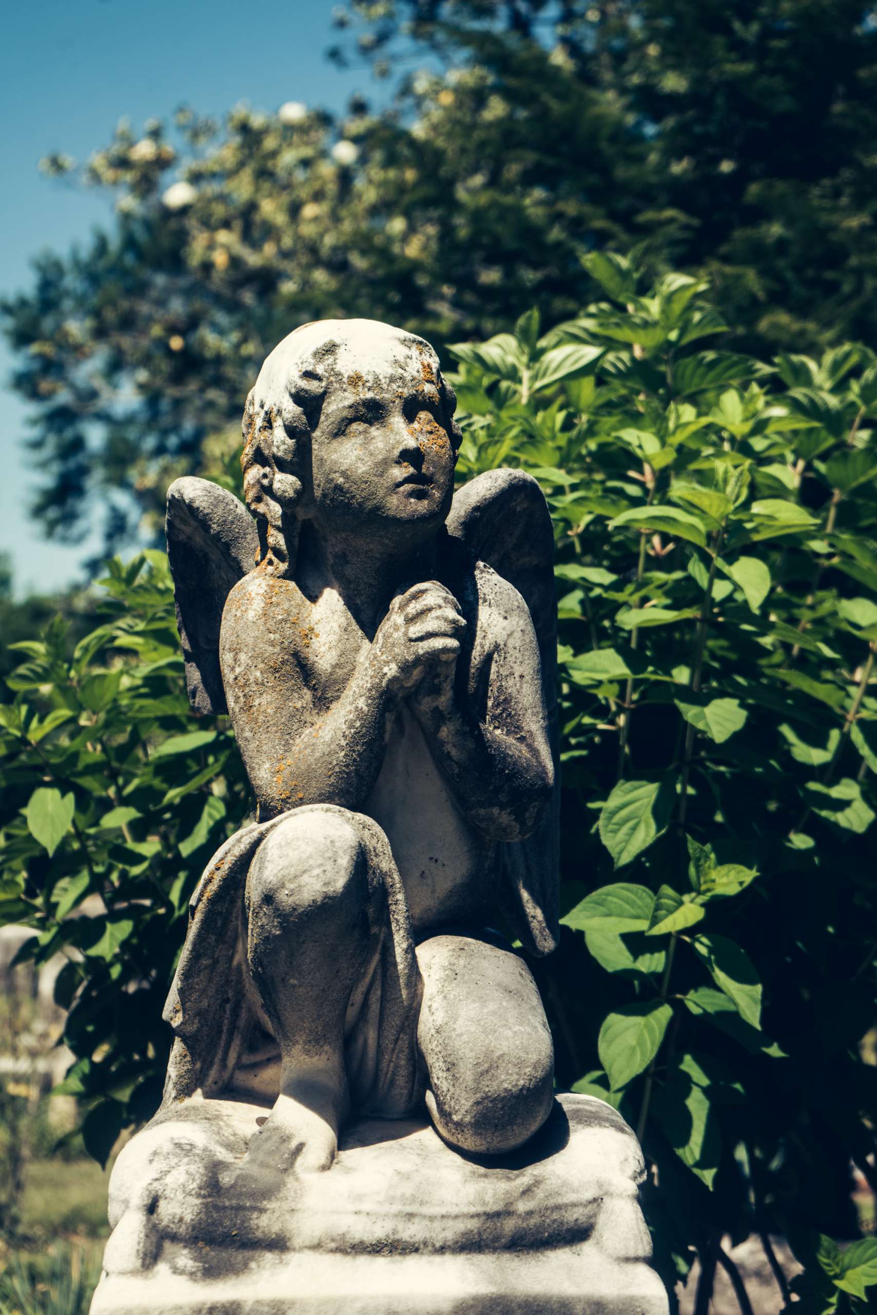 A weathered statue of an angel.