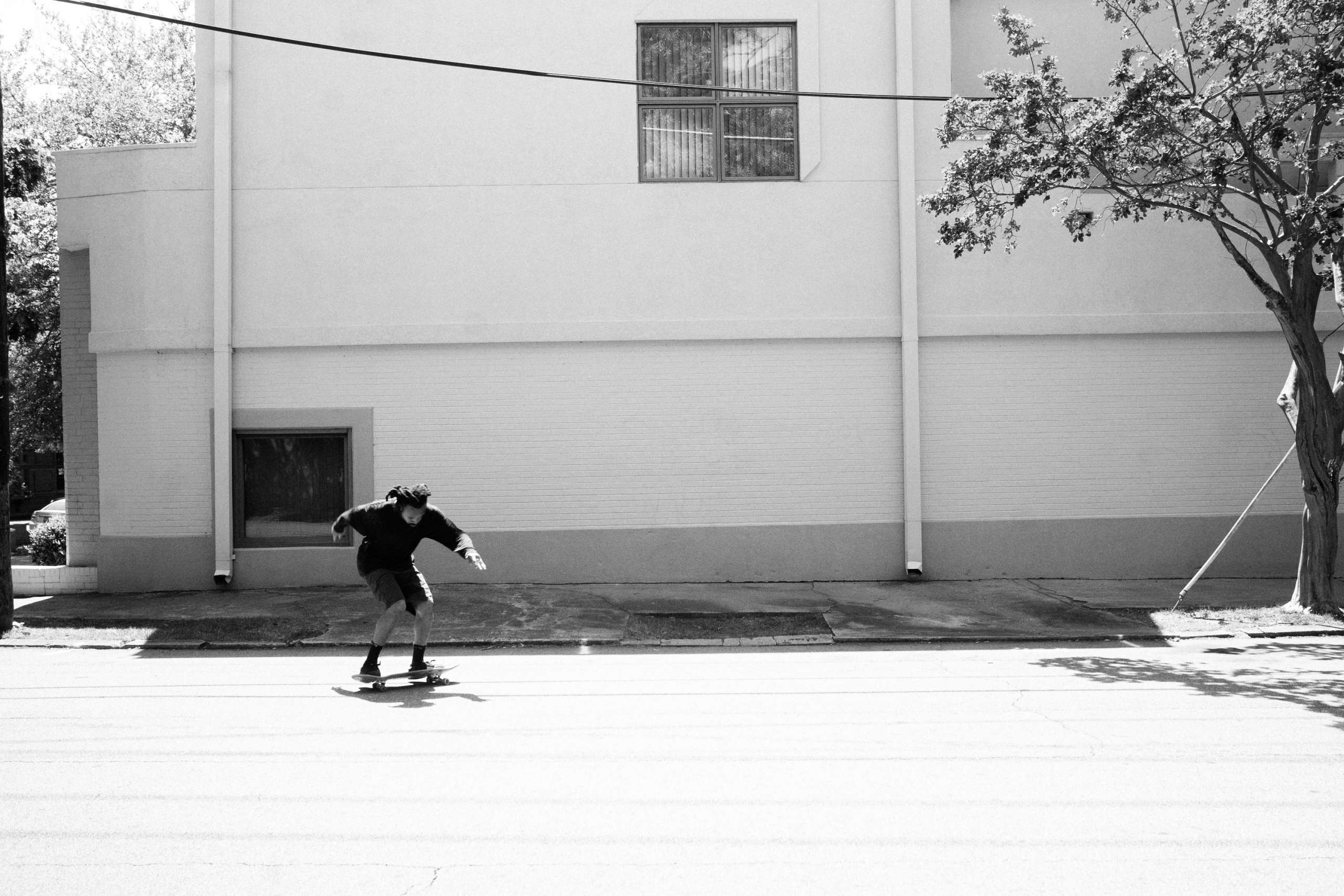 Man skating in black and white.