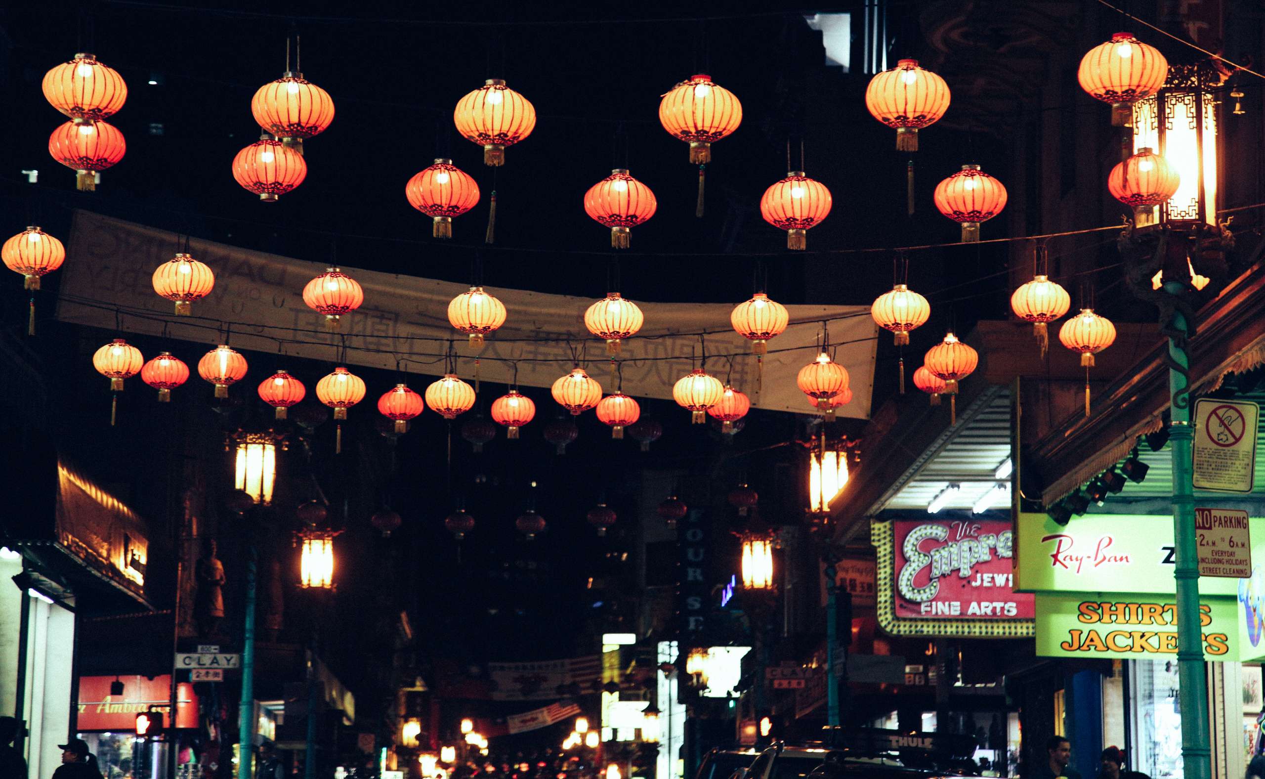 Chinese lanterns strung and lit at night.