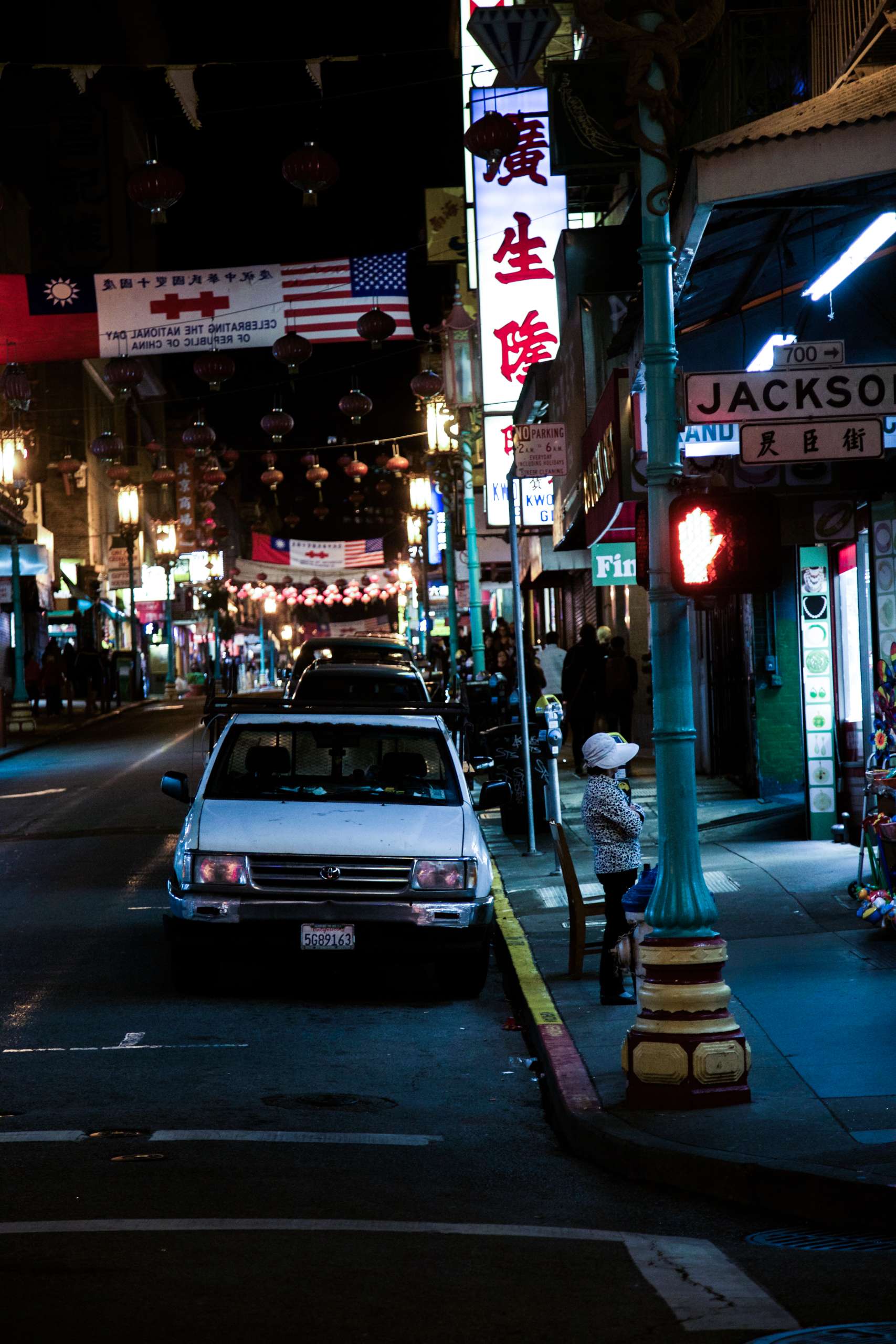 Empty car sits in China town at night.