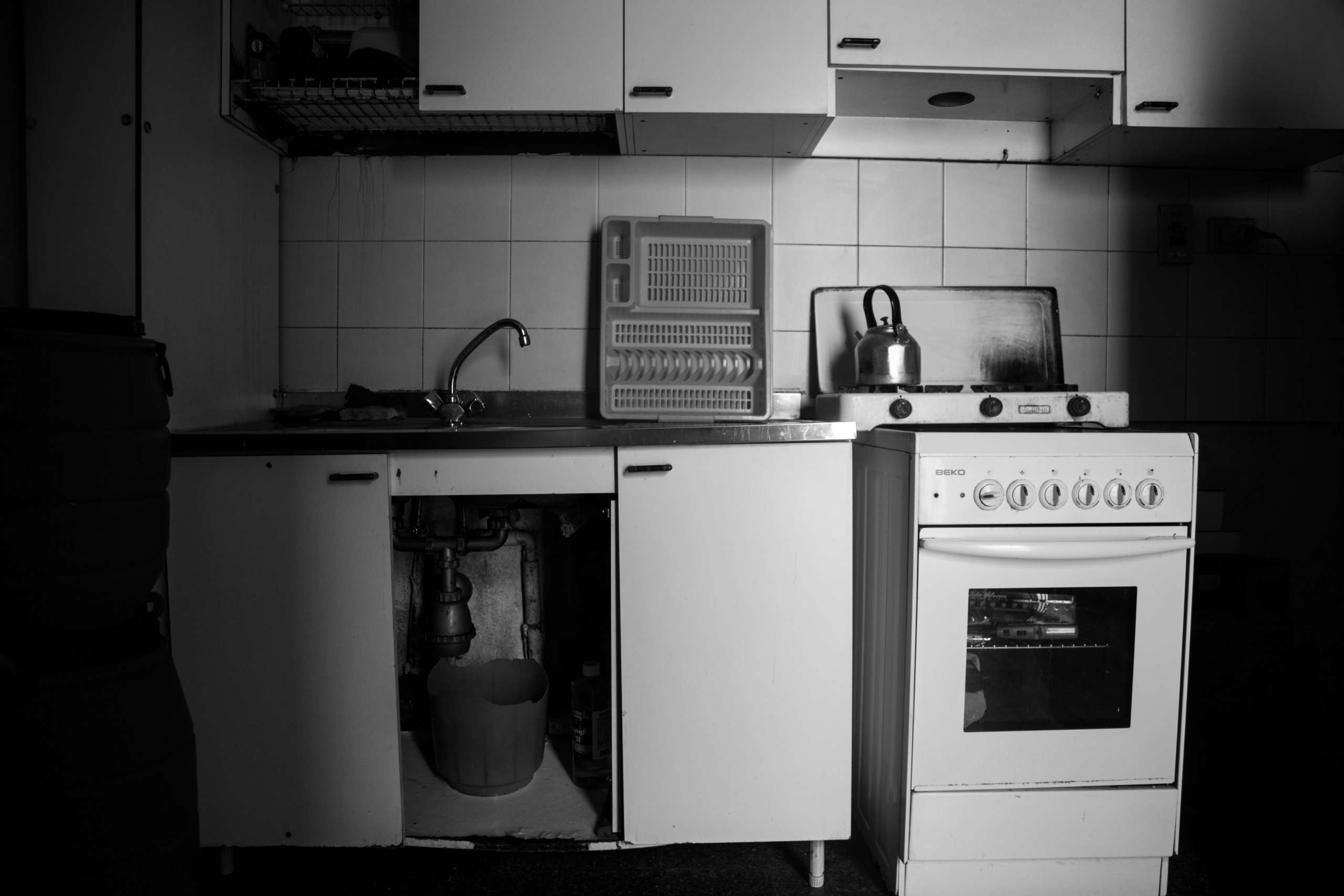 Empty kitchen in black and white.